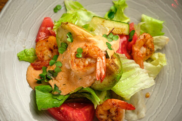 Grilled spicy lamb and salad wrapped in flatbread, with tomatoes