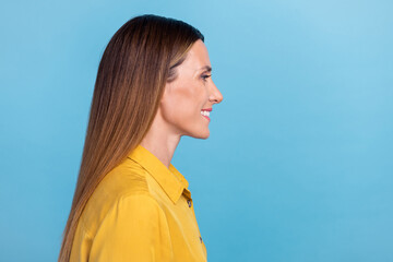 Profile photo of optimistic mature brown hairdo lady look promo wear yellow shirt isolated on blue color background