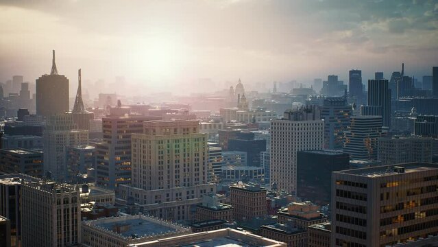 View to the motorway intersection in New York. Active urban traffic in the megapolis at sunrise. Expressway, high skyscrapers downtown on horizon. Drone top shots. USA, North America