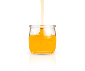 Honey pot and dripping honey isolated on white background