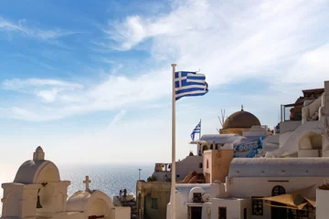 Zelfklevend Fotobehang Greece flag over old greek town. © 9parusnikov