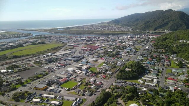 Biggest settlement on West Coast, New Zealand. Beautiful sunny day in Greymouth. - aerial drone