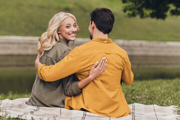 Fototapeta premium Rear back behind view portrait of amorous adorable cheerful couple spouses hugging enjoying outdoors