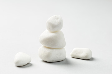 Balancing zen pebble stones on grey background