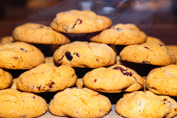 Homemade oatmeal cookies with fruit filling stacked on top of each other.