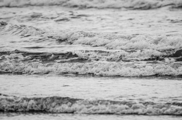Gentle waves on a sandy beach