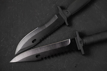 folding knives on a black background. pen knives on a dark background