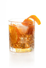 Old fashioned drink with orange and ice