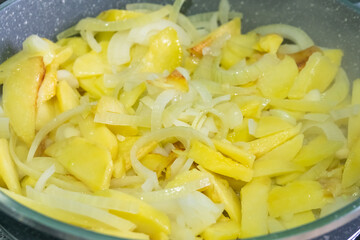 Frying pan with french fries, appetizing rustic golden potatoes