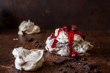 Meringue cake with chocolate and cherries