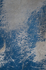 Vertical blue cement wall with scratches texture