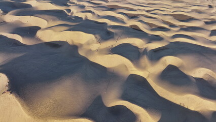 Sand dunes meet the Atlantic Ocean. Top view of Maspalomas sand dunes. © Dmytro Kosmenko