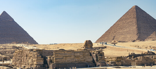 The Great Pyramid of Giza is a defining symbol of Egypt and the last of the ancient Seven Wonders of the World. The massive temple complex of Karnak was the principal religious center of the god Amun. - obrazy, fototapety, plakaty
