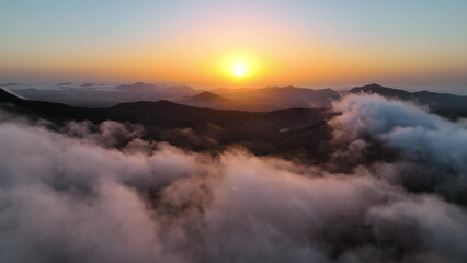 Top view of the sunrise over the mountains. Aerial view of Fuerteventura