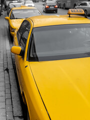 Taxi parking on the city street. Classic yellow taxi cars in New York