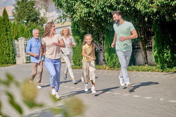 Smiling family running and enjoying time together