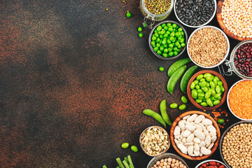 Legumes, beans and sprouts. Dried, raw and fresh, top view. Red beans, lentils, mung beans, chickpeas, soybeans, edamame, green peas, Healthy diet food, vegan protein, micronutrients fiber sources