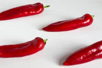 Red sweet peppers on a white background. Paprika. Chili pepper.