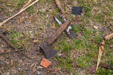 Ax and scissors for metal on the ground