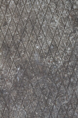Texture of gray concrete with a pattern in a rhombus. Background