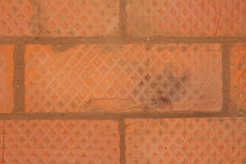 Texture of red brick with gray cement joints