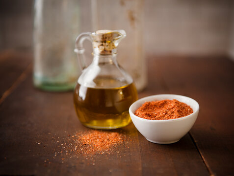 Small bottle of olive oil and bowl of spices