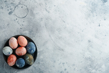 Easter eggs. Dyed Easter eggs with marble stone effect ref and blue color in rustic style on light...