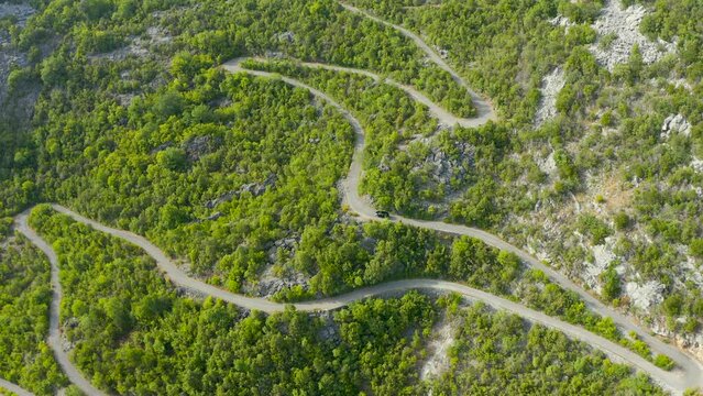Drone view of a mountain serpentine road in Montenegro.