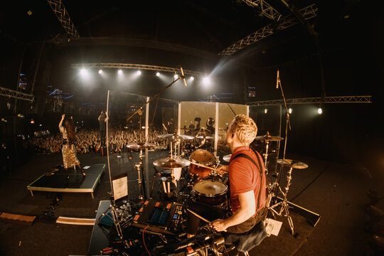 drummer on stage behind the kit