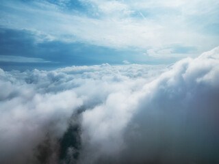 Fototapeta na wymiar Fluffy white clouds from above