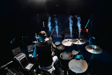 drummer on stage behind the kit