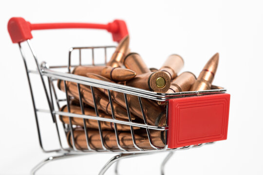 Closeup of a small shopping cart with ammunition inside. 7.62x39 rifle bullets.