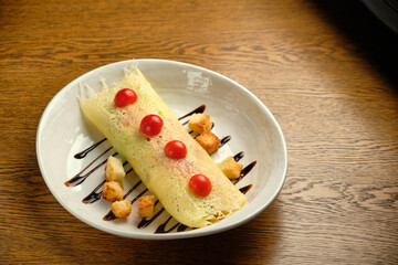 Grilled spicy lamb and salad wrapped in flatbread, with tomatoes