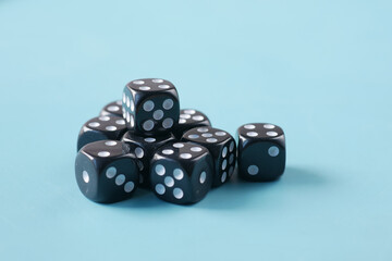 Black Dice on a blue color background 
