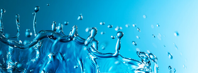 Abstract Splash of Water on a Blue Background - obrazy, fototapety, plakaty