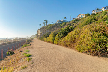 Dirt road in between the train tracks and slope at San Clemente, California