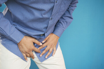 the concept of prostate and bladder problem, crotch pain of a young person 