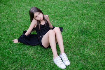 portrait of adorable teen brunette girl in black clothes outside. charming ukrainian child enjoying...