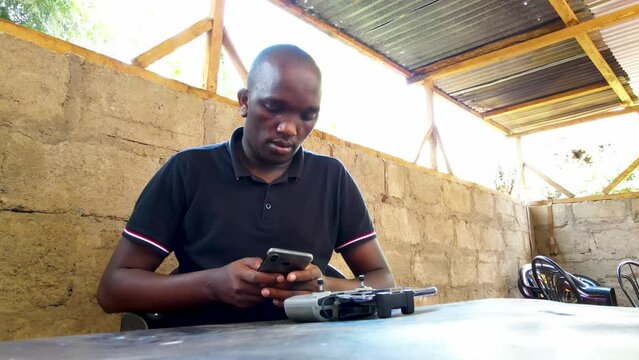 Africa phone technology. Africa man using phone.