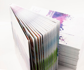 a stack of photo books and magazines