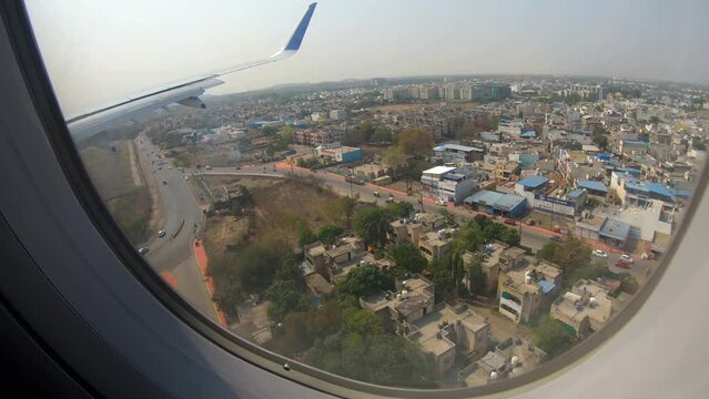 Houses and roads seen from landing airplane