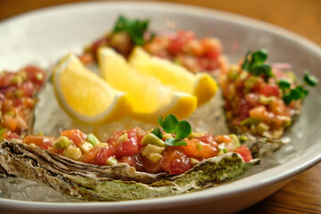 Beef tartar with salad and garlic toast on dark bread