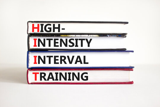 HIIT high-intensity interval training symbol. Concept words HIIT high-intensity interval training on books on a beautiful white background. HIIT high-intensity interval training concept. Copy space.