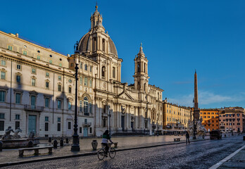 Fototapeta na wymiar Piazza Navona and Church of Saint Agnes at the Circus Agonalis in morning time. Rome, Italy
