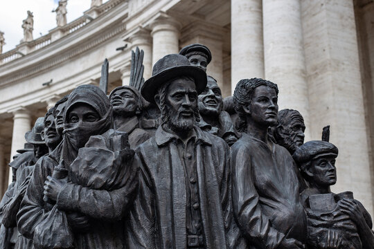 Rome, Italy - April 2, 2022: Fragment of the monument "Angels Unawares” dedicated to the world's migrants and refugees, by the Canadian artist Timothy Schmalz, St. Peter's Square in Vatican.