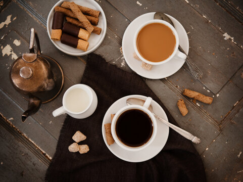 Cups of coffee with cookies 