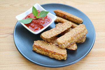 Pan fried Tempeh with homemade marinara sauce, an easy and tasty dish of whole foods plant-based diet