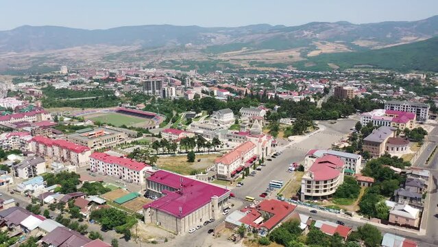  Aerial view  Stepanakert the capital of Nagorno-Karabakh (Artsakh) region. Drone fly over new, modern buildings, stadium, hotels. Aerial footage Center of Stepanakert.
