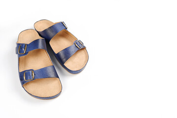 A pair of men's blue leather sandals highlighted on a white background.Summer men's shoes. Flat orthopedic slippers of a doctor or nurse.Shop of workwear, uniforms.Copyspace