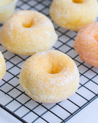 A round Japanese homemade doughnut or Bomboloni, sweet bakery prepared for fried with hot oil.